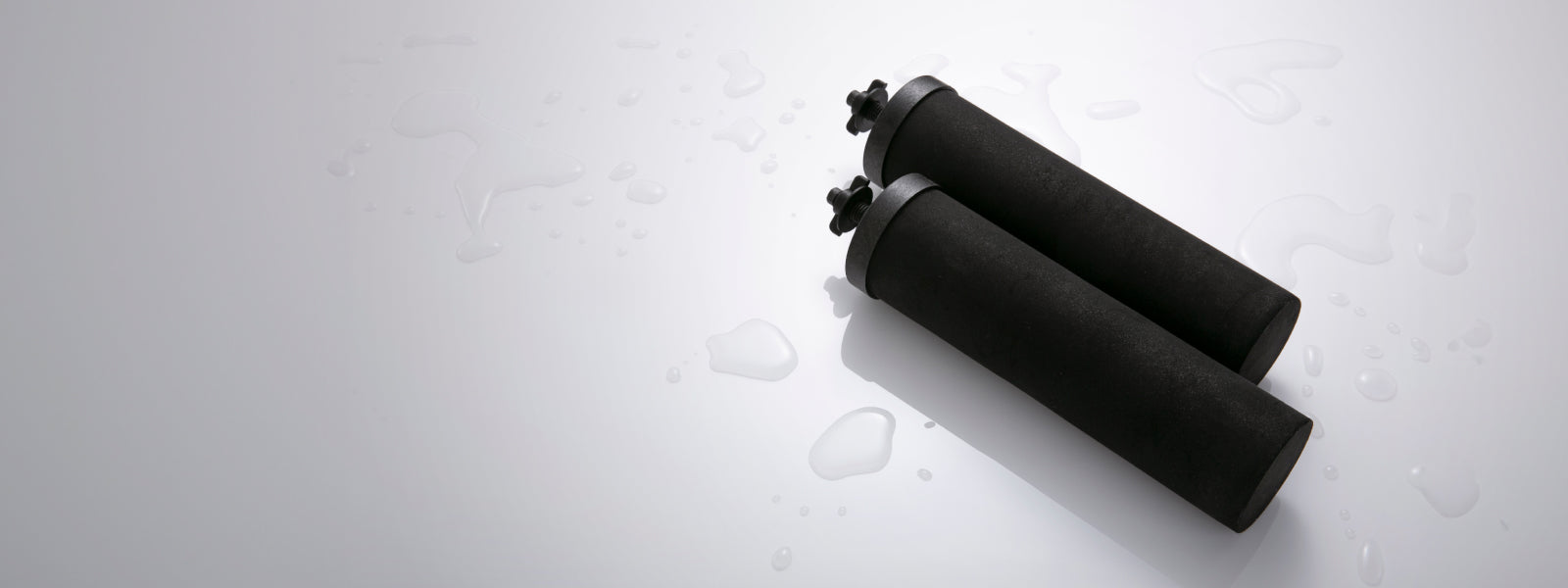 Black Berkey water filters on a white background